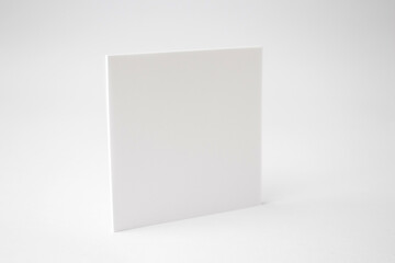 A blank square white empty paper on white background