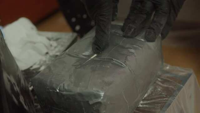 Drug dealer cutting a package of Illegal Substances