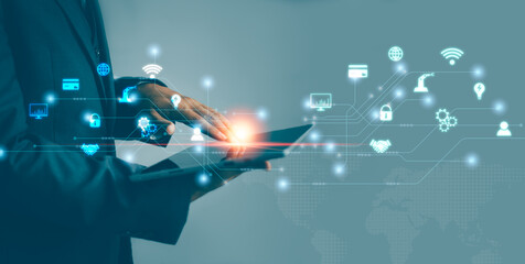 Business and Technology. Businessman holding tablet hand touching on screen to manage and protect digital data.
