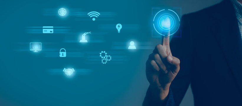 Technology and Business. Businessman touching to digital icon fingerprint blue background.