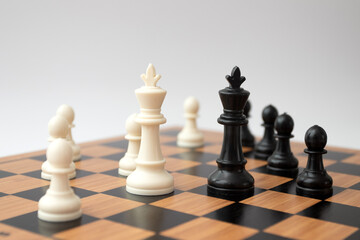 Black and white chess pieces on the chess board