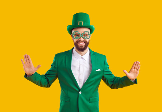 Patricks Day. Pensive Bearded man wearing in hi green leprechaun hat gesturing stop signal. Irish tradition holiday. Carnival costume for traditional party. Isolated on yellow background.