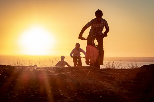 People riding bicycles at sunrise, Duluth, Minnesota, USA