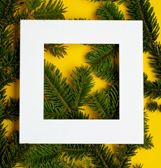 Creative frame of Christmas tree branches and decorations with space for text. Top view. Xmas and New year concept.