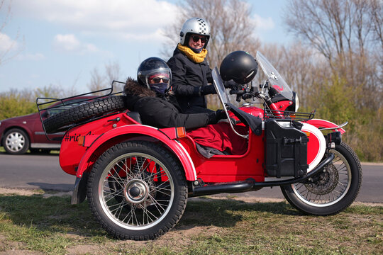 Two ladies preparing for a motorcycle sidecar adventure in Holland.
