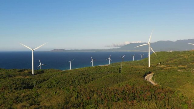 Aerial drone of Wind turbines on the coastline. Wind power plant. Philippines.Wind turbines on the coastline. Wind power plant. Philippines.