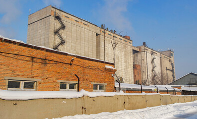 Elevator grain storage. kazakhstan (Ust-Kamenogorsk). Old industrial building. Building for storing and drying grain. Old elevator. Winter. December 2022