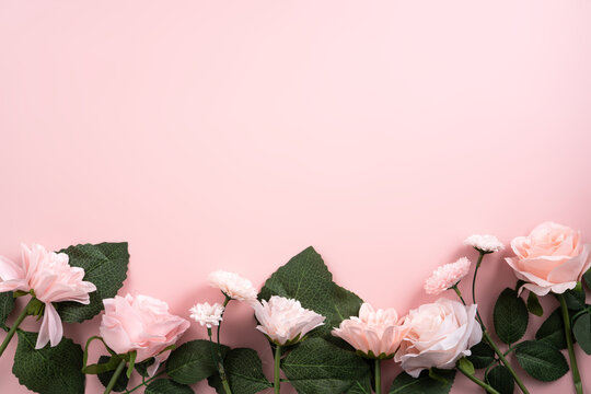 Valentine's Day and Mother's Day design concept background with pink flower and gift on pink background.