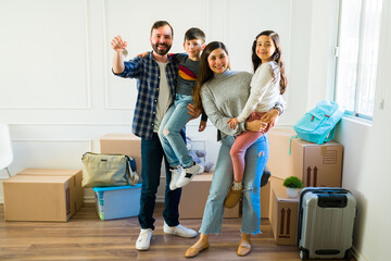 Full length of a family receiving the new house keys