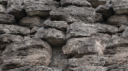 A pattern of huge cobblestones on a sheer rock
