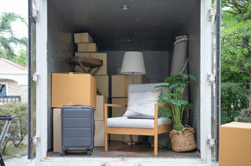 Truck car moving house for customers, delivering boxes and furniture. Vehicle transportation. Shipping and packaging business occupation service company. People lifestyle.