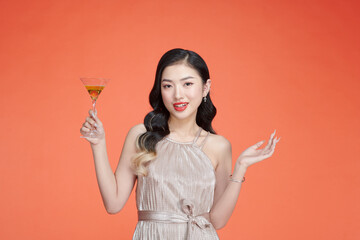 beautiful sexy woman in glamorous dress with white wine glass