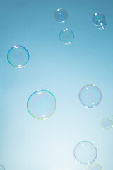 Soap Bubbles on A Blue Natural Background. Soap Sud Bubbles Water. Bubbles background