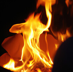 Close up of burning paper with fire on black background, created using generative ai technology