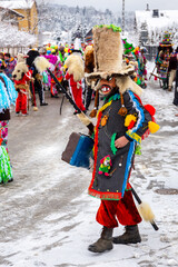 Milowka, Poland, 21.01.2023. Gody Zywieckie - traditional winter parade of 'Dziady', folk custom in Zywiec region, man dressed in traditional colorful costume of a Jew, Milowka, Poland.