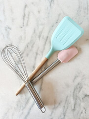  kitchen utensils, tools and equipment on a marbel background