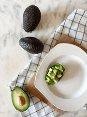 Ripe avocado fruit on plate ready to eating