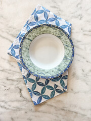 plate on tablecloth for food on a marbel background