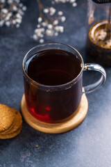 Hot black tea in glass cup, hot comfort drink