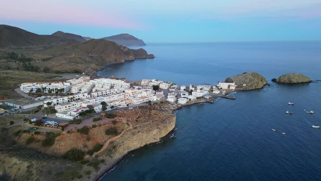 Cabo de Gata Coast during twilight in Isleta del Moro, Almeria, Andalusia, Spain - Aerial 4k