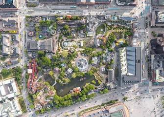Aerial view directly above the Tivoli Gardens amusement park and pleasure garden, famous landmark and attraction of Copenhagen city, Denmark  - obrazy, fototapety, plakaty