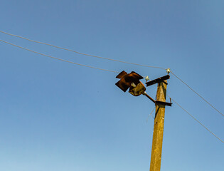 Power electric pole with line wire on colored background close up