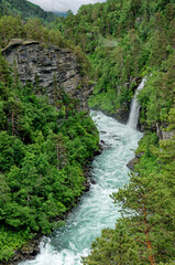 Fototapeta na wymiar Travel destination Norway - Waterfall - Jostedalsbreen National Park