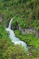 Obraz na płótnie Canvas Travel destination Norway - Waterfall - Jostedalsbreen National Park