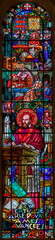 ANNECY, FRANCE - JULY 11, 2022: The St. Francis de Sale on the stained glass of Basilique de la Visitation church designed by Ch. Plessard and made by M. Chigot (20. cent.)