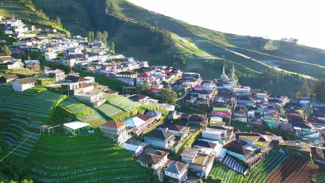 Aerial view of beautiful village and plantation on the slope of mountain in the morning. Nepal van java on the slope of Sumbing Mountain