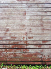 Front view of exterior wooden wall. Wall of horizontal wooden sheets. Close up of old fence of wooden planks. Architecture and constructions.