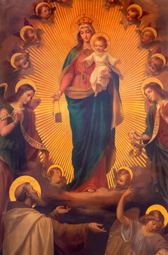 BIELLA, ITALY - JULY 15, 2022: The painting of Madonna of Scapular as the helper of souls in purgatory with the St. Simon Stock  in Cathedral (Duomo) from 19. cent.