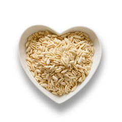 Dry pasta Cavatelli in white plate heart shape isolated on transparent or white background. View from above.