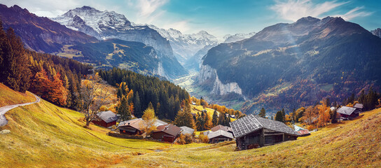 Wonderful Sunny landscape in Swiss alps. Wengen popular tourist village over the Lauterbrunnen...