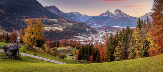 Gorgeous mountain scenery in the Bavarian Alps. Scenic image of nature landscape during sunset. Alpine village of Berchtesgaden and Watzmann massif with colorful sky. Popular travel destination