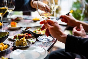 man hand hold glass of white wine
