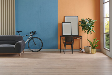 Modern working room interior home decoration, orange and blue textured wall background, vase of plant, bike.