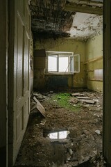 abandoned interior ruined building with broken window