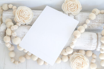 white, blank, paper card, invitation with wooden beads and flowers farmhouse styled mock-up