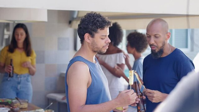 Happy family eating in a traditional brazilian barbecue.  People spending time together at barbecue.
