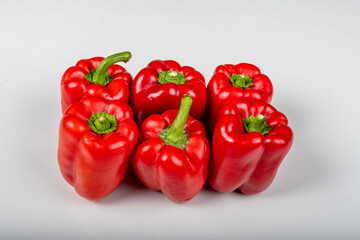 Set of fresh whole and sliced sweet pepper, red bell pepper, White background