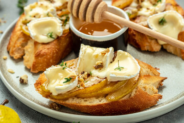 Pear and brie crostini with honey, walnut and thyme, New Years Eve or Christmas party appetizer....