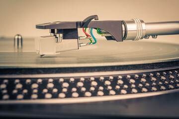 Fototapeta na wymiar Playing a vinyl record on a turntable