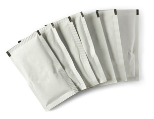 stack of blank white sachet packets isolated, close-up of food or medicine drug packaging mockup...