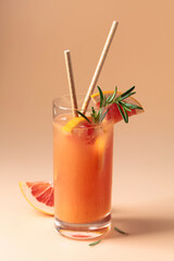 Summer cocktail with grapefruit, rosemary, and ice.