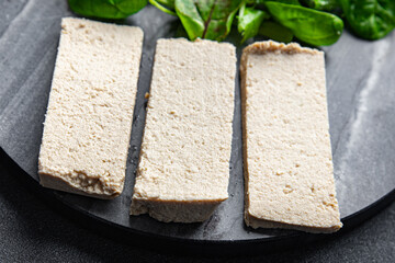 tofu soy product vegetable cheese healthy meal food snack on the table copy space food background rustic top view keto or paleo diet veggie vegan or vegetarian food