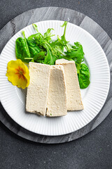 tofu soy product vegetable cheese healthy meal food snack on the table copy space food background rustic top view keto or paleo diet veggie vegan or vegetarian food