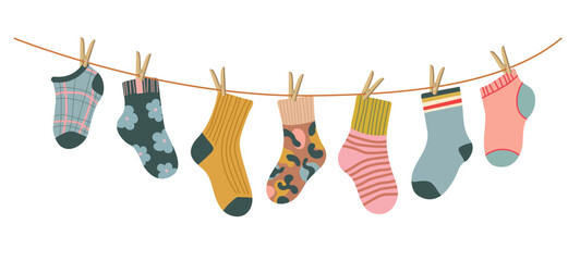 Socks on rope. Cotton or wool sock dry and hang on laundry string with clothespins. Children socks with textures and patterns vector cartoon. Illustration wool and cotton socks in rope