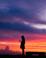 silhouette of a person in the sunset