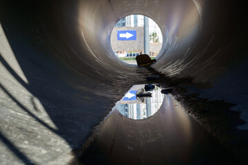 Puddle in the inside of a large scratched tube